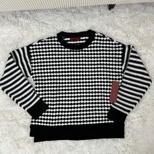 Mixed black and white stripe and checkered pullover knit sweater